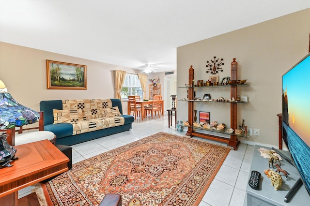 living room with ceiling fan and light tile patterned floors