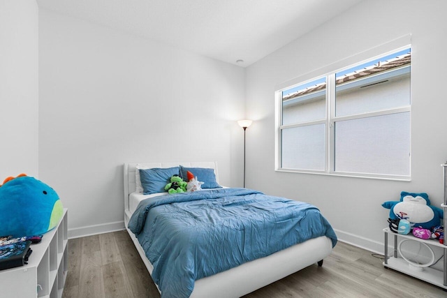 bedroom with wood-type flooring