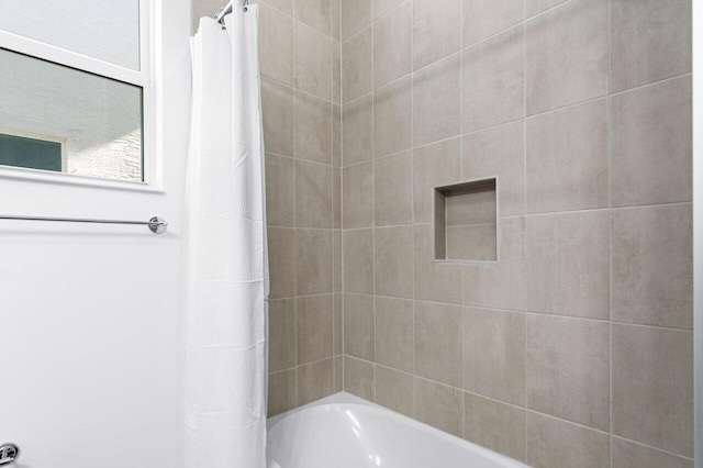 bathroom featuring shower / bath combo with shower curtain