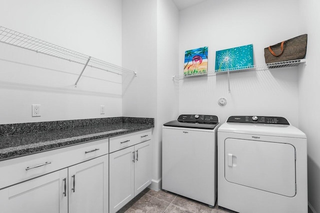 clothes washing area featuring washer and clothes dryer