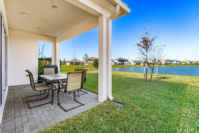 view of patio featuring a water view