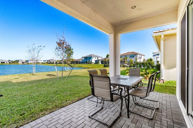 view of patio featuring a water view