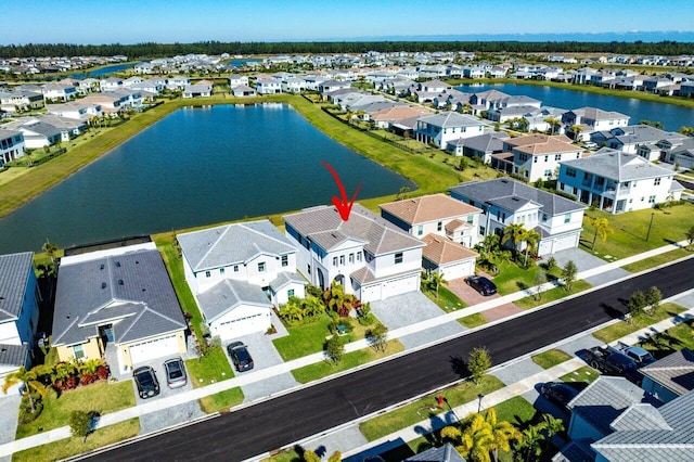 birds eye view of property with a water view