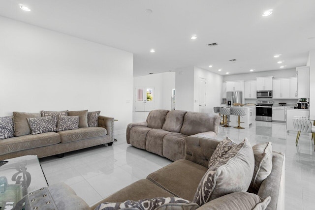 living room with light tile patterned flooring