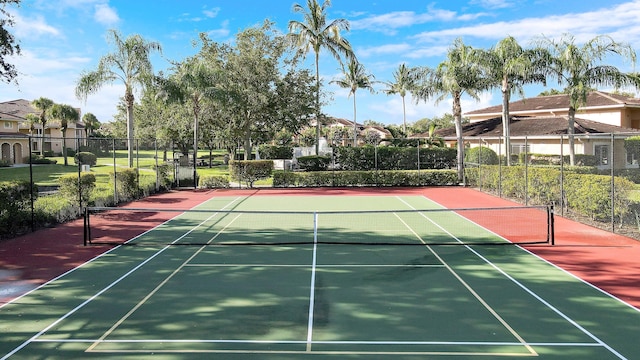 view of tennis court with basketball hoop