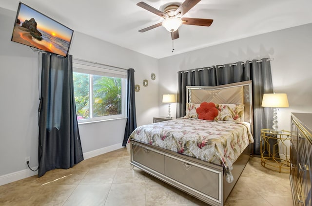 tiled bedroom featuring ceiling fan