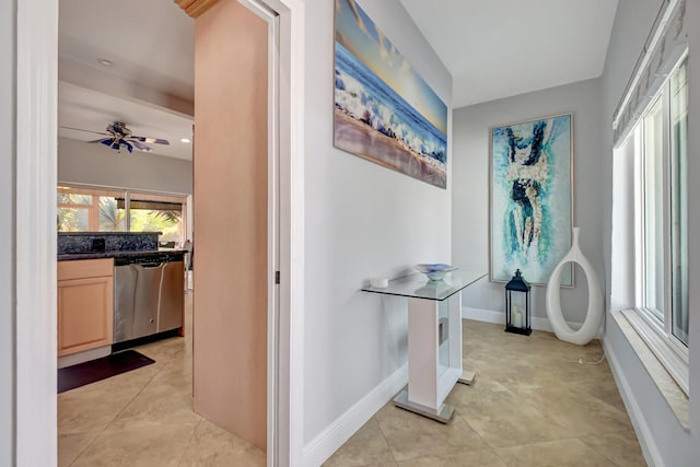 hallway featuring light tile patterned floors