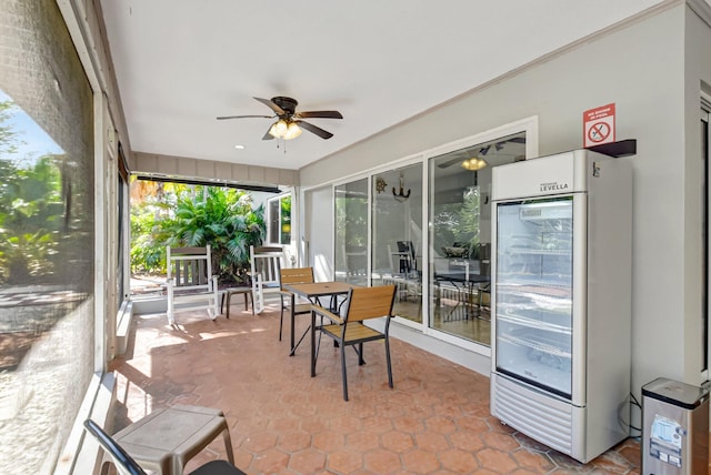 sunroom / solarium with ceiling fan