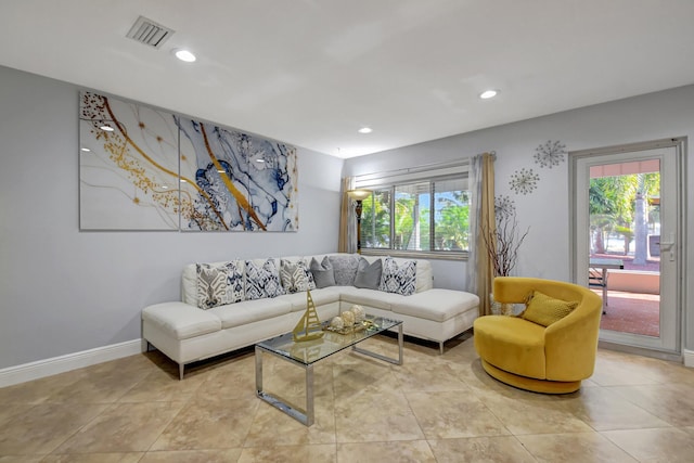 tiled living room featuring plenty of natural light