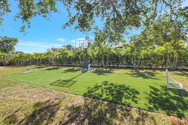 view of yard with basketball court