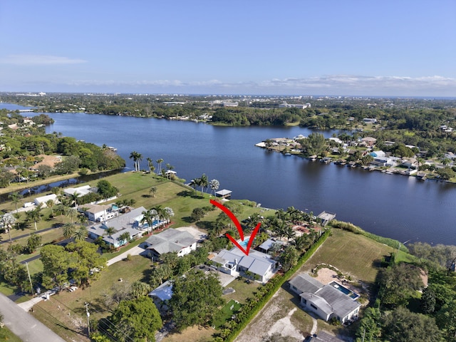 birds eye view of property with a water view