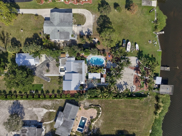 birds eye view of property with a water view