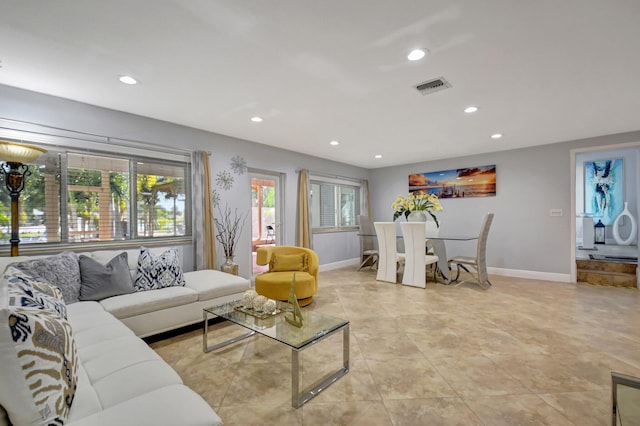 living room featuring a wealth of natural light