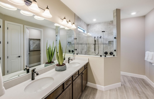 bathroom featuring vanity and a tile shower