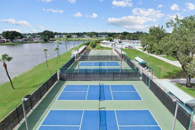 view of tennis court with basketball court and a water view