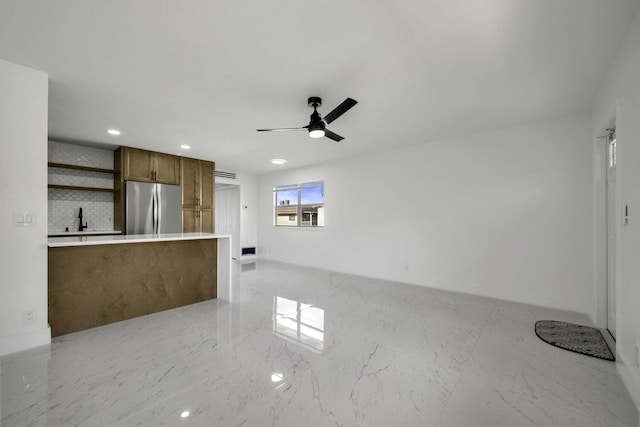 interior space featuring sink and ceiling fan