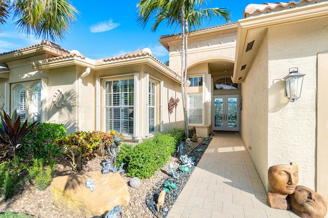 view of exterior entry featuring french doors