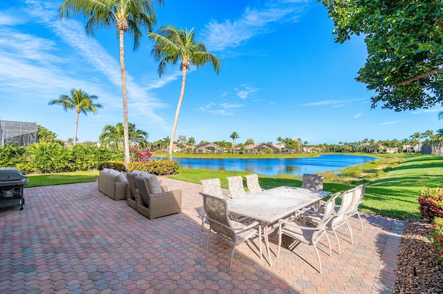 view of patio featuring a grill and a water view