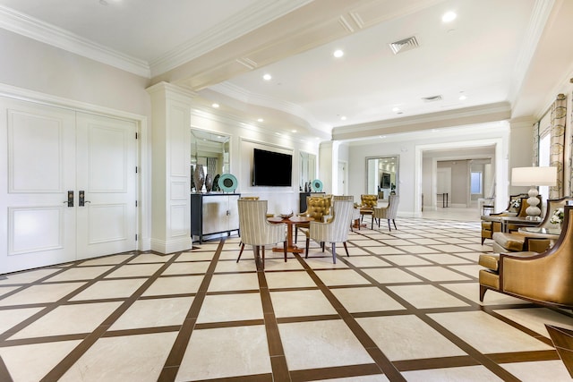 living room with ornamental molding and french doors