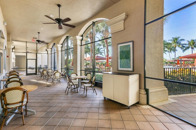 sunroom / solarium with ceiling fan