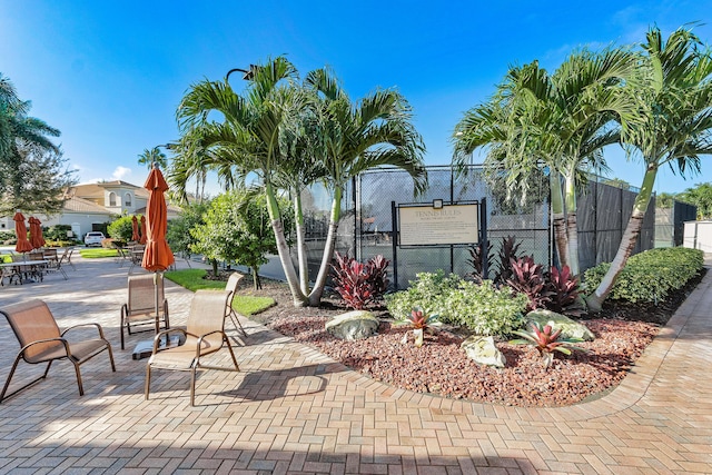 view of home's community with a patio area