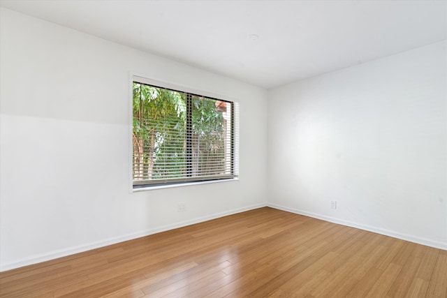 unfurnished room featuring light wood-type flooring