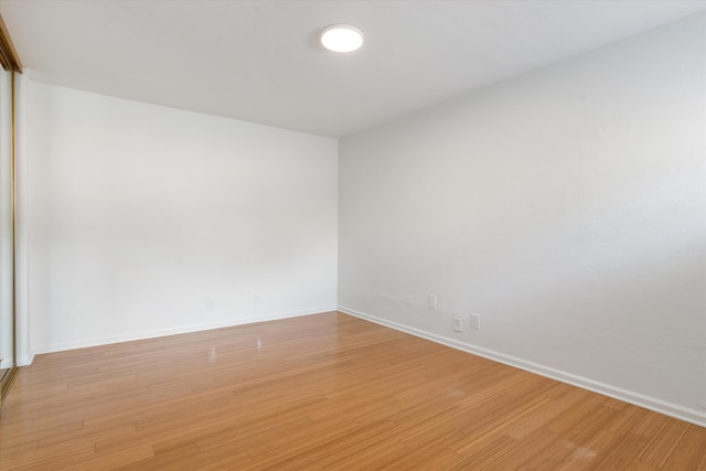 spare room with light wood-type flooring