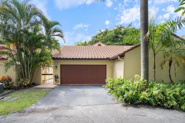 mediterranean / spanish-style home featuring a garage