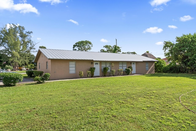 single story home featuring a front yard