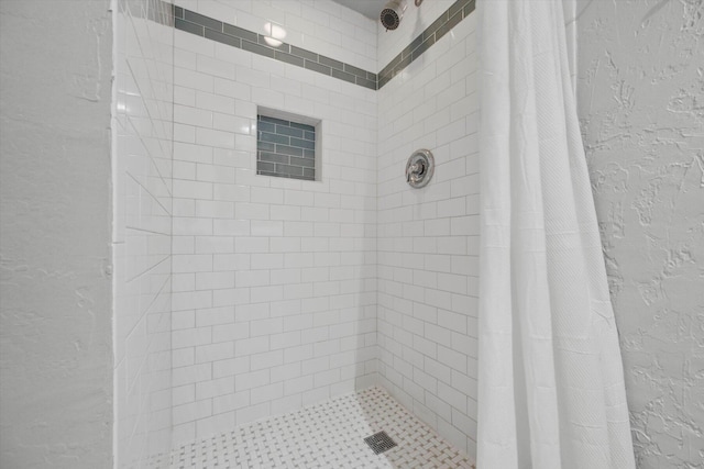 bathroom with a shower with shower curtain