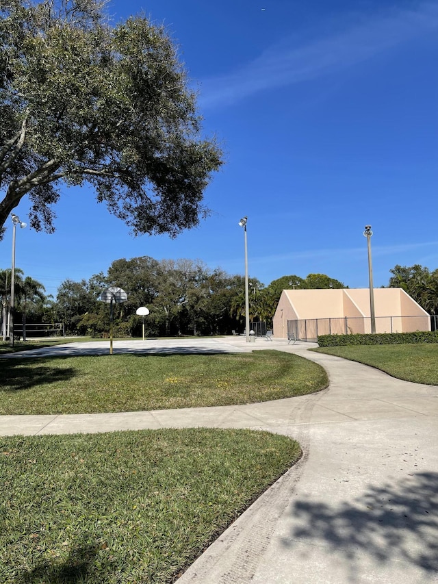 view of home's community with a yard