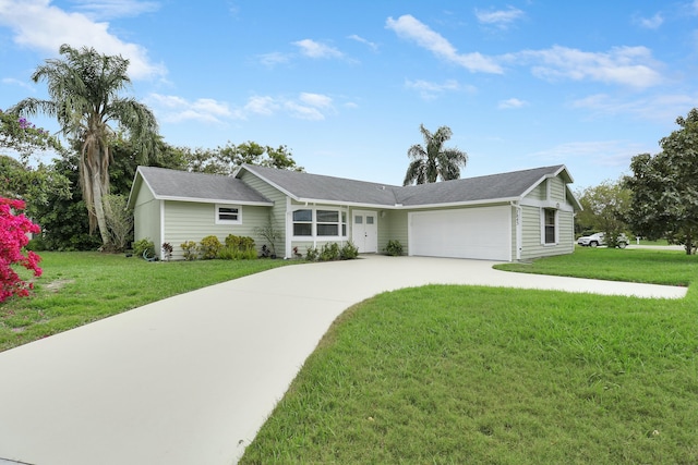 single story home with a front yard and a garage