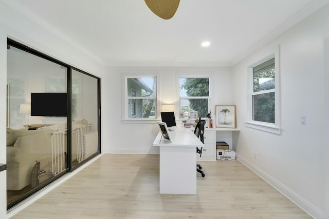 office space with recessed lighting, baseboards, crown molding, and light wood finished floors