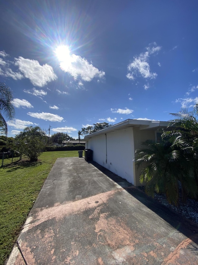 view of home's exterior featuring a yard