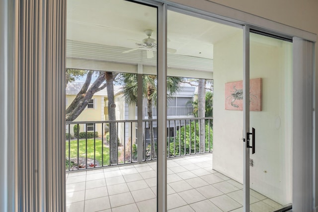 doorway to outside featuring ceiling fan and light tile patterned floors