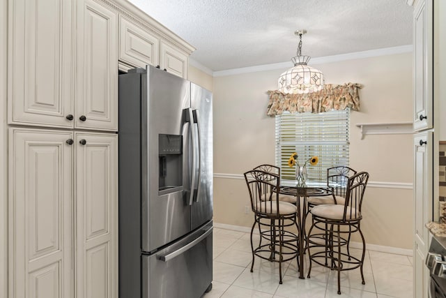 kitchen with a textured ceiling, decorative light fixtures, light tile patterned floors, stainless steel refrigerator with ice dispenser, and crown molding