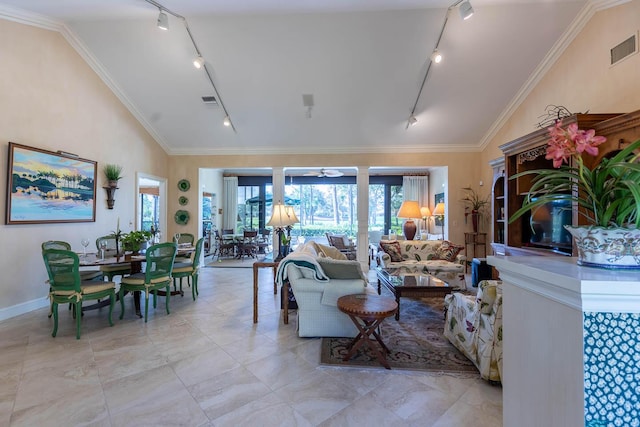 living room with rail lighting, high vaulted ceiling, and crown molding