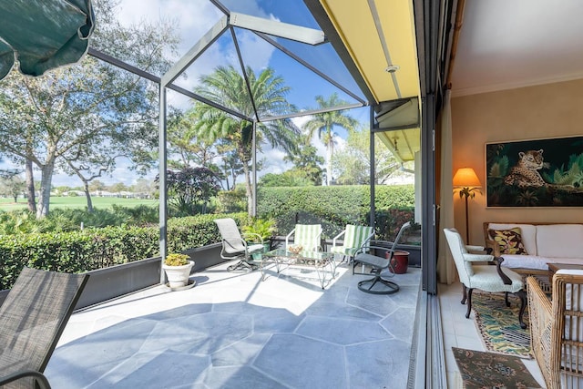 view of patio / terrace with an outdoor living space and glass enclosure