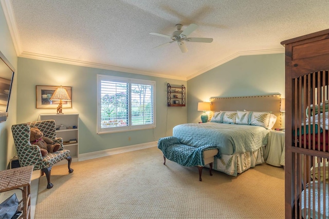 bedroom featuring crown molding, ceiling fan, carpet floors, a textured ceiling, and vaulted ceiling