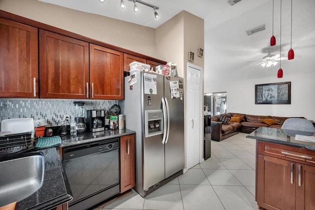 kitchen with stainless steel refrigerator with ice dispenser, tasteful backsplash, light tile patterned floors, dark stone countertops, and dishwasher