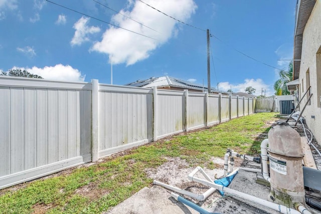 view of yard with central AC unit