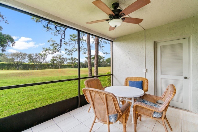 sunroom / solarium with ceiling fan