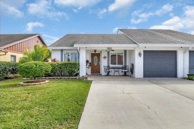 ranch-style house with a front lawn, a garage, and covered porch