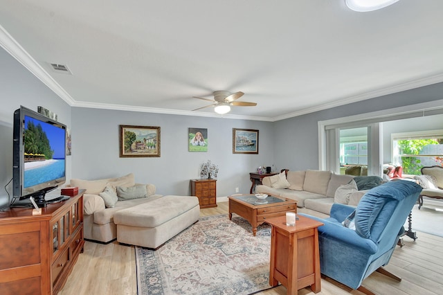 living room with ceiling fan, light hardwood / wood-style floors, and crown molding