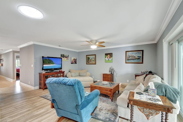 living room with ceiling fan, light hardwood / wood-style flooring, and crown molding