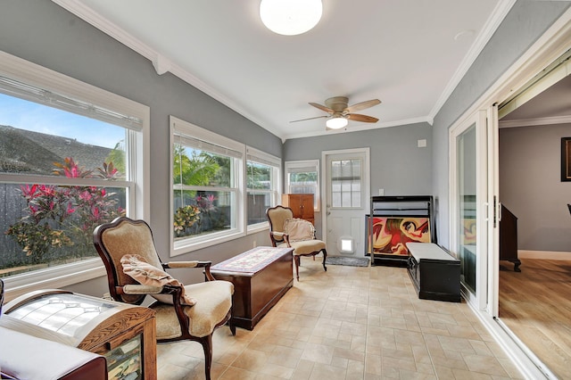 sunroom featuring ceiling fan