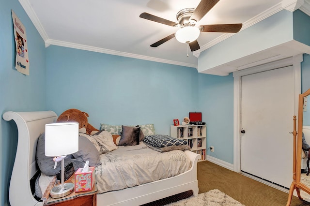 bedroom featuring ceiling fan, carpet floors, and ornamental molding