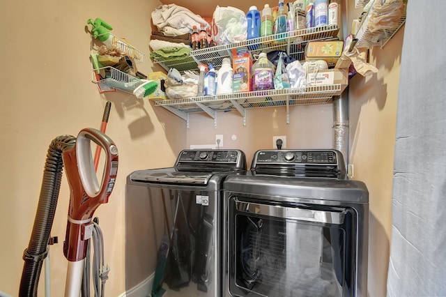 clothes washing area featuring washer and clothes dryer