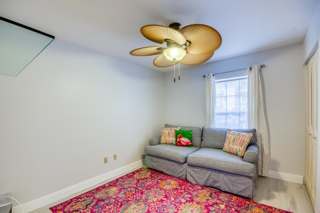 sitting room featuring ceiling fan and light hardwood / wood-style flooring