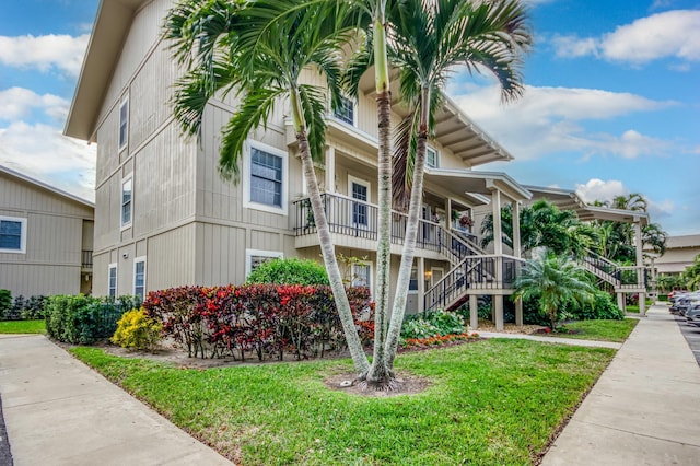 18460 SE Wood Haven Ln Unit D, Jupiter, FL 33469 - view of building exterior featuring stairs